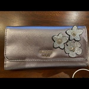 Guess wallet.  Rose gold metallic.